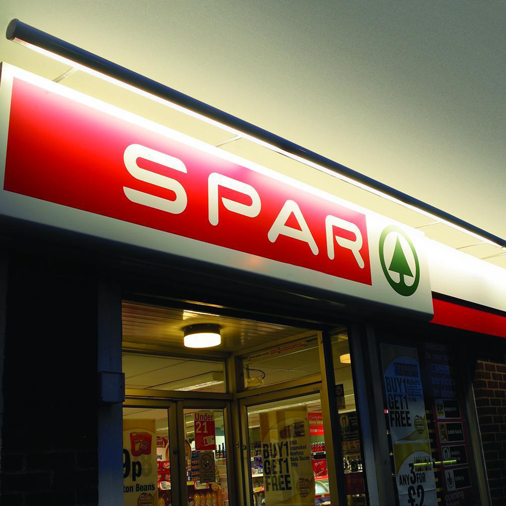 Image of  shop sign trough lighting taken at night