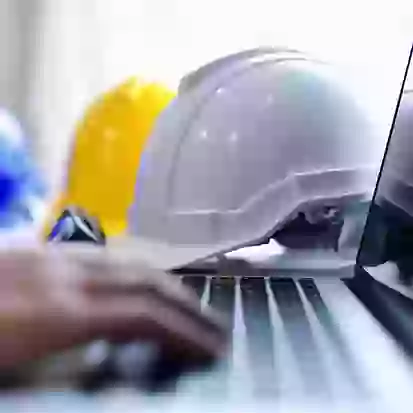 image of hard hat and laptop during a site survey